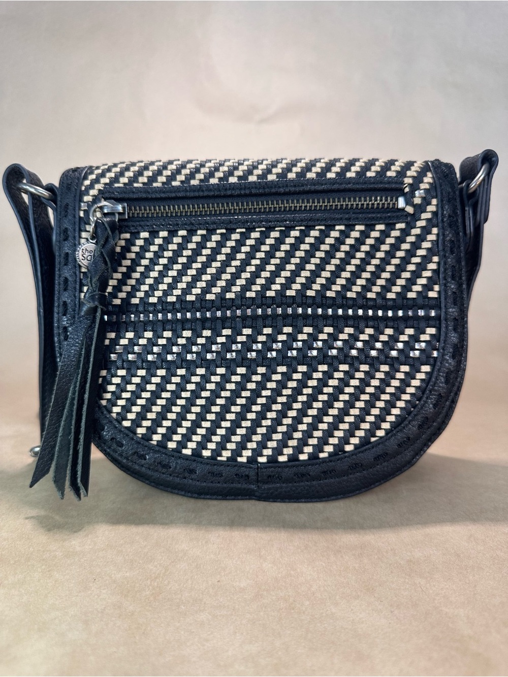 The Sak Black & Cream Woven Crossbody Saddle Bag